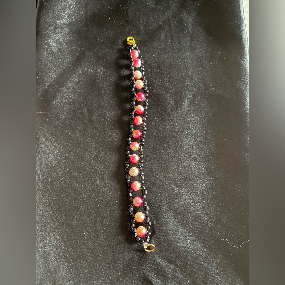Elegant Beaded Bracelet with Red and Black Accents